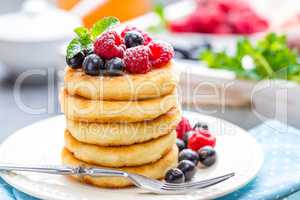 Cottage cheese pancakes, syrniki, curd fritters with berries