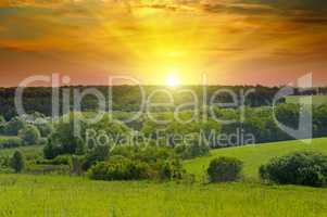 Green fields and bright sunrise