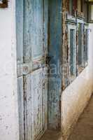 Old house wall with wooden door