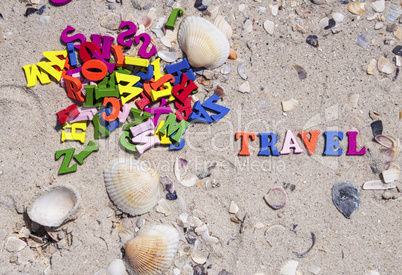 word travel is made up of small multicolored  letters