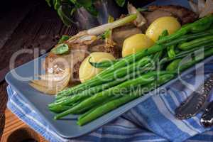 Beef medallions with caramelized beans and young potatoes