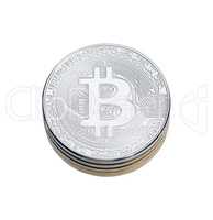 SIlver bitcoin on white background.