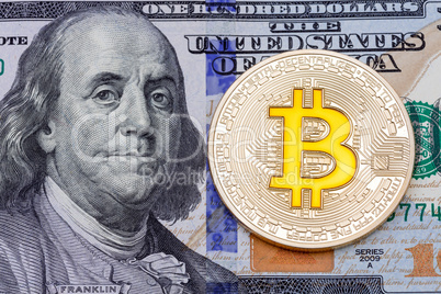 Golden cruptocurrency yellow 'bitcoin on one hundred dollar bank