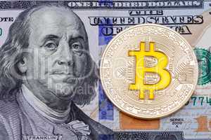 Golden cruptocurrency yellow 'bitcoin on one hundred dollar bank