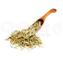 Dried Sweetgrass Hierochloe on the wooden spoon.
