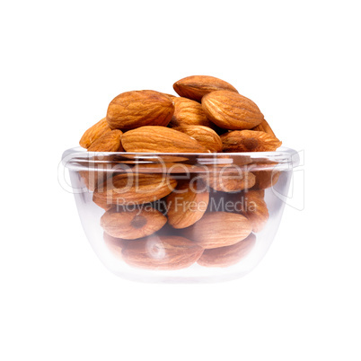 Close up of nuts in saucepan on white background.