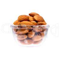 Close up of nuts in saucepan on white background.
