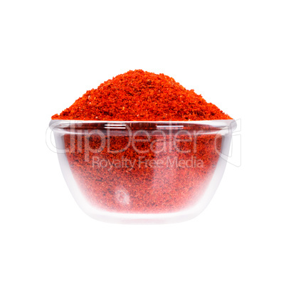 Powdered pimienta roja red pepper in saucepan, macro shot.