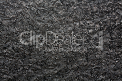 Black granite texture on macro.
