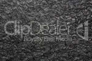 Black granite texture on macro.