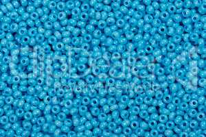 Background of baby blue glass cane beads.