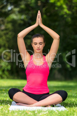 Female Young Fit Healthy Woman or Girl Practicing Yoga Outside