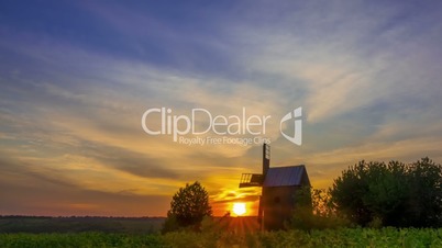 Sunrise and an Old Wooden Windmill. Time Lapse