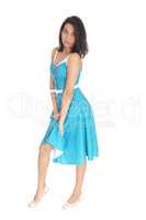 Serious Hispanic woman in blue dress.