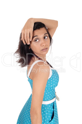 Beautiful Hispanic woman with her hands over her head.