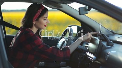 Woman using navigation app on smartphone in car