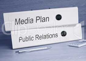Media Plan and Public Relations - two binders in the office