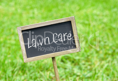 Lawn Care - chalkboard on green grass background