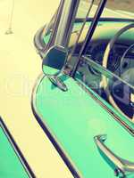 Detail of a turquoise vintage car