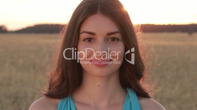 Summer portrait of charming woman at sunset