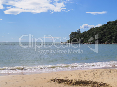 Sunny beach, in sunny day, with sea and cable in the background