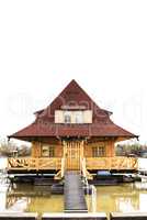 Wooden house on river