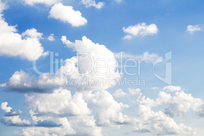 Fluffy Clouds In The Blue Sky