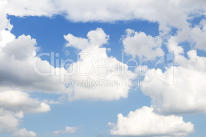 Fluffy Clouds In The Blue Sky