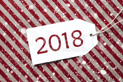 Label On Red Wrapping Paper And Snowflakes, Text 2018