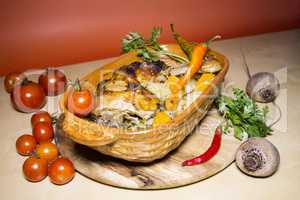 Grilled chicken legs with potatoes and vegetables