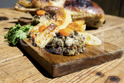 Roasted Duck On Wooden Table With Vegetables