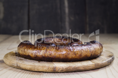 Fried Sausages On a Wooden Board