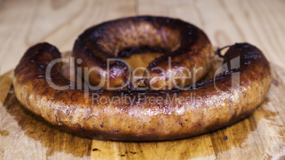 Fried Sausages On a Wooden Board