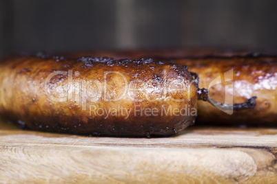 Fried Sausages On a Wooden Board