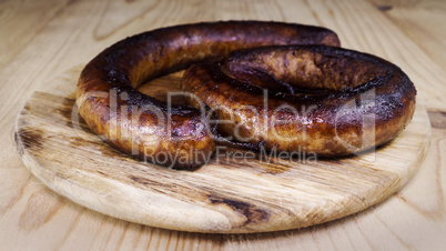 Fried Sausages On a Wooden Board