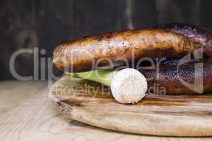 Fried Sausages On a Wooden Board