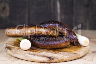 Fried Sausages On a Wooden Board