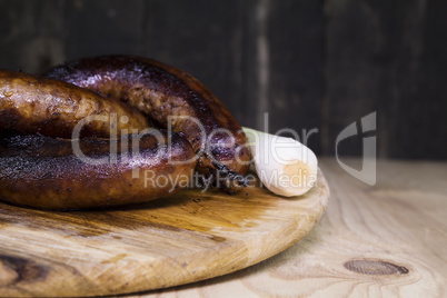 Fried Sausages On a Wooden Board