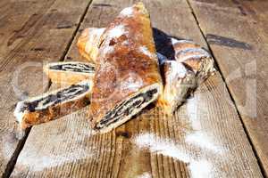 Strudel with poppy seeds on a Wooden Table