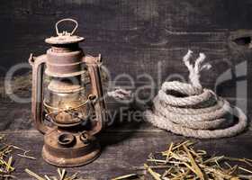 Old lantern on wooden background