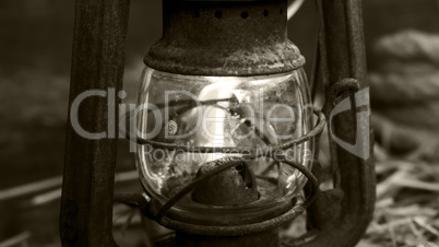 Old lantern on wooden background