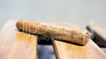 Cuban cigar resting on a wooden surface