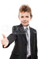 Smiling child boy in business suit gesturing hand greeting or me
