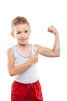 Smiling sport child boy showing hand biceps muscles strength