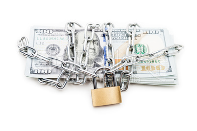 Chain link with padlock on dollar currency money