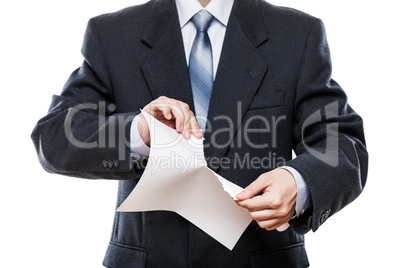 Angry businessman hand tearing paper document