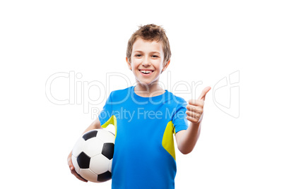 Handsome smiling child boy holding soccer ball gesturing thumb u