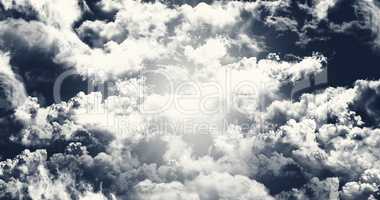 Dark Sky With White Fluffy Clouds Illustration