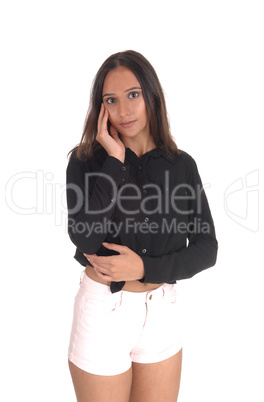 Young smiling woman standing in shorts