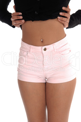 The front few of a young woman in pink shorts